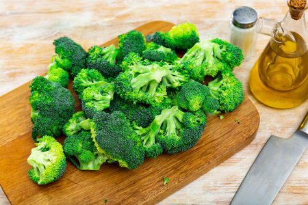 Bunch of fresh green broccoli on wooden background. Healthy vegetarian foodの写真素材