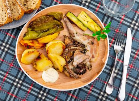 Portion of just cooked rabbit with vegetablesの写真素材