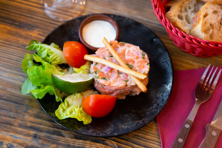 French appetizer salmon tartare with onion creamの写真素材
