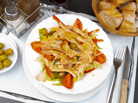 Chicken salad with vegetables and spicy sauceの写真素材