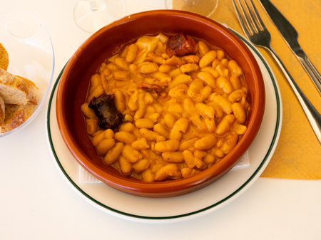 Traditional dish of Spanish cuisine is Fabada soupの写真素材