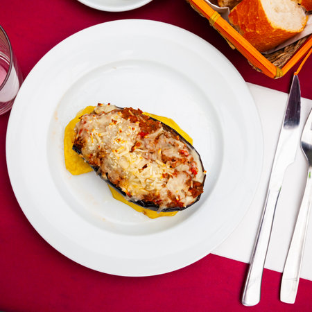 Eggplant stuffed with baked vegetables in sauce and baked cheeseの写真素材