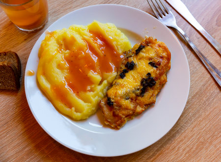 Traditional Russian dish chicken fillet with mushrooms with mashed potatoesの写真素材