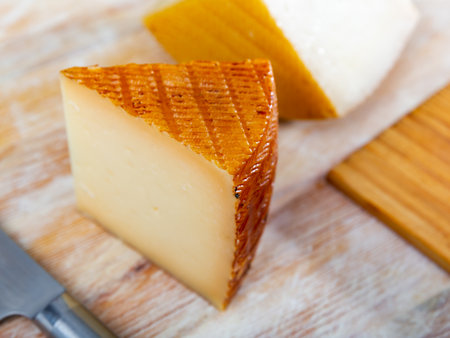 Sliced spanish artisanal semi hard cow milk cheeseの写真素材