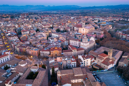 View from drone of Spanish town of Vic with ancient cathedral in winter eveningの写真素材
