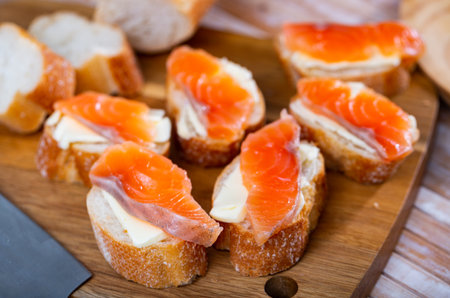 Salmon toasts with butter. Delicious lunchの写真素材