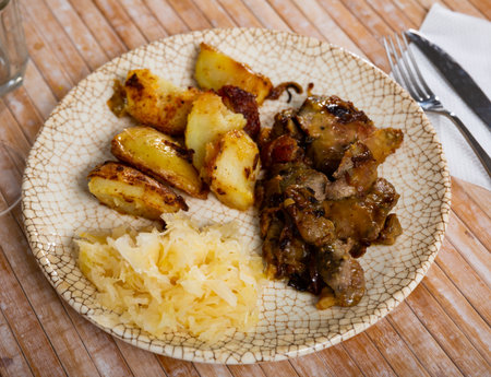 Appetizing fried rabbit liver with vegetablesの写真素材