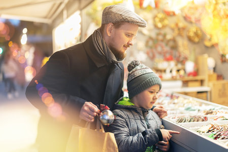 Father and son choose toys for the Christmas treeの写真素材