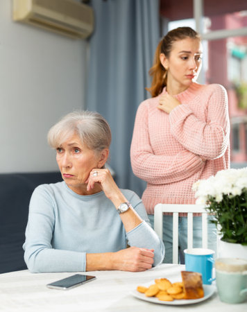 Quarrel between senior mother and adult daughterの写真素材