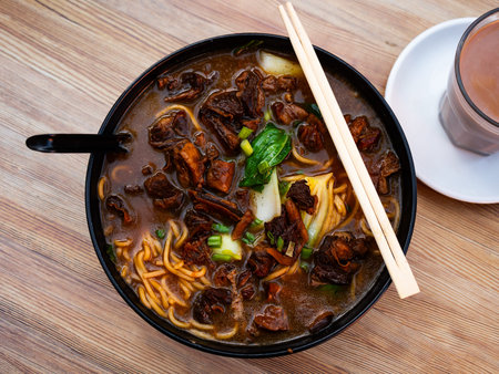 Soup with pasta and boiled beef tenderloin is traditional Chinese cuisine dish