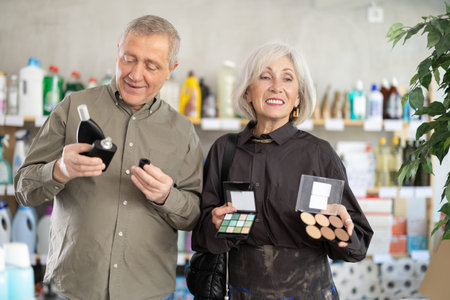 Husband and wife choose cosmetics and perfumes in the supermarket