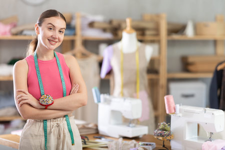 Woman fashion designer is in office.