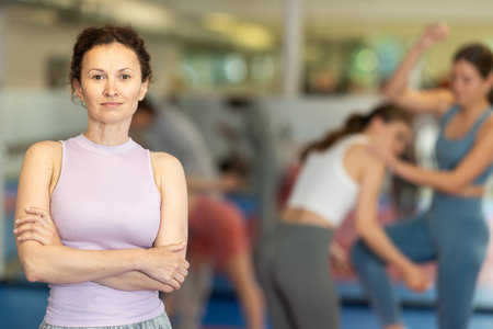 Woman athlete pose before training in gym