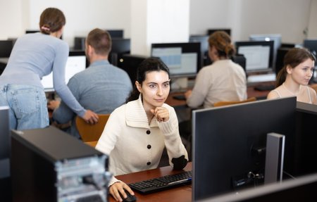 Female student at computers in university computer class