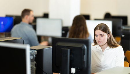 Young woman working on computer in office