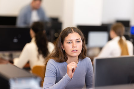 Young woman working on computer in officeの写真素材