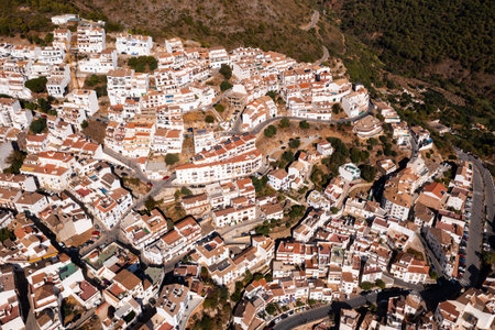 Drone view of the small town with white houses and surrounding countryside, Ojen, Spain in the summerの写真素材