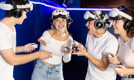 Group of friends chat animatedly after playing virtual reality