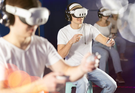 Guy in vr glasses playing with friends