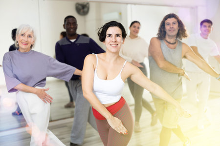 Group of dancing people practicing energetic swing