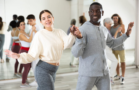Dancing positive couples learning salsa
