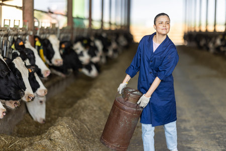 Asian woman employee with metal milk can
