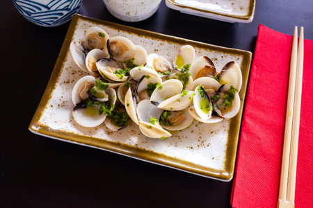 Japanese sake steamed clams with ginger and green onionsの写真素材