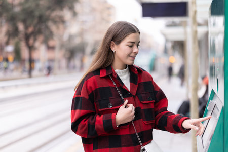 girl pays for a tram fareの写真素材