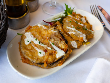 Battered eggplant slices with yogurt sauceの写真素材