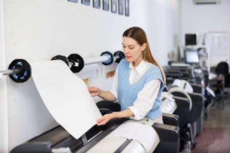 Woman working in publishing facility