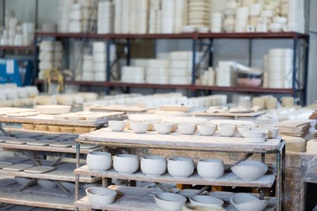 Finished crockery is waiting for painting and drying. Made from white clayの写真素材