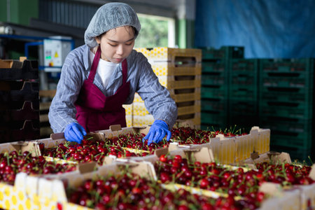 Girl working at the cherry warehouse