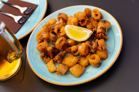 Chipirones, breaded fried calamari with lemon