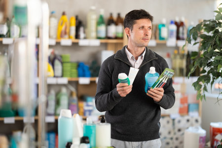 man buys toothbrushes in a storeの写真素材
