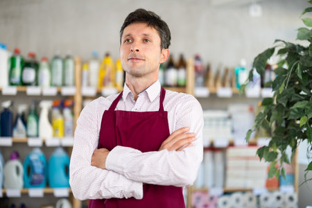 Portrait of friendly male salesperson in an interior housewares storeの写真素材