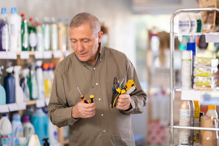 man chooses tools for the houseの写真素材