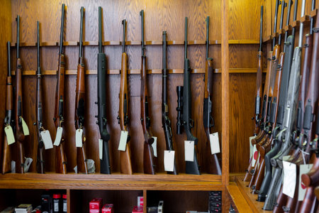 Gun store interior with rifles on showcase