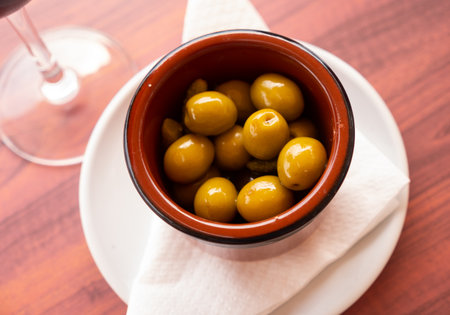 Pickled green olives with cucumber, spanish dish - Olivas verdes y pepinosの写真素材