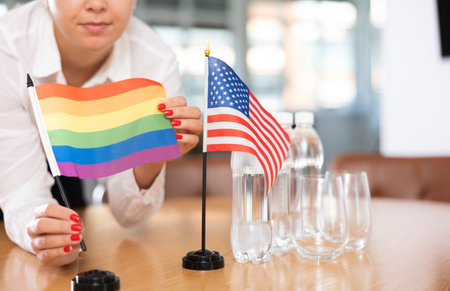 Flags of United States and LGBT on negotiating tableの写真素材