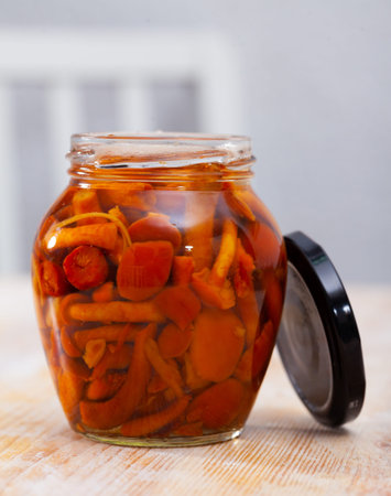 Glass jar of marinated mushrooms nameko