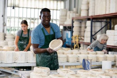 Positive man potter with mould for new ware