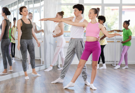 Teenage boy and girl rehearsing paired ballet
