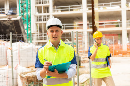 Young civil engineer makes important work notes