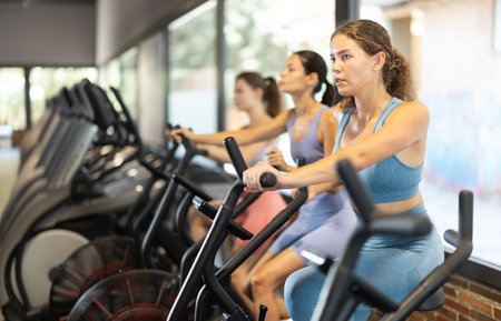Woman on an airbike in the gym