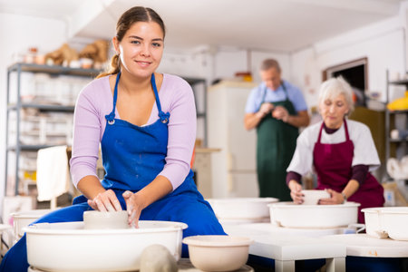 girl works with potter wheelの写真素材