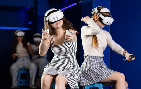 Girl in headset playing VR games against each other in room