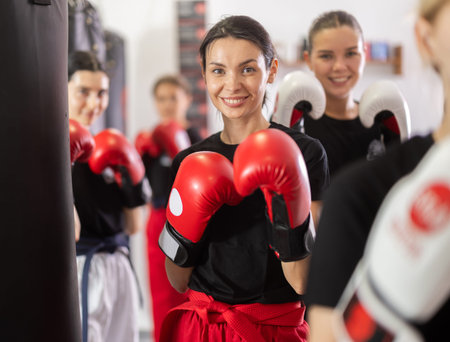Young girl posing with boxing gloves