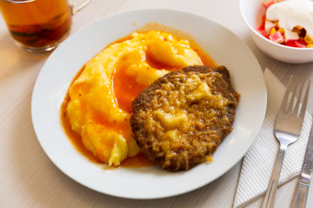 Russian dish - schnitzel with cheese and mashed potatoes. Slavic cuisineの写真素材