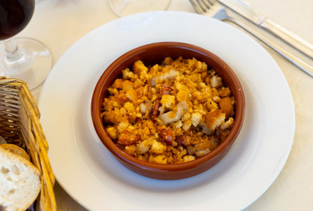 Plate with typical spanish dish migas pastoriles. Spanish cuisineの写真素材
