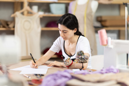 Armenian woman drawing sketch on paperの写真素材